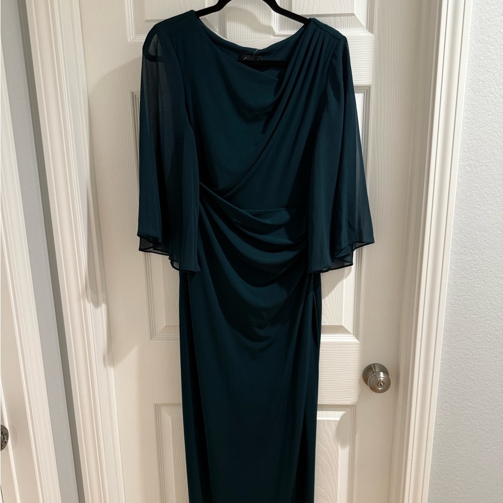 Emerald green gown with sheer sleeves and shirred bodice for flattering fit